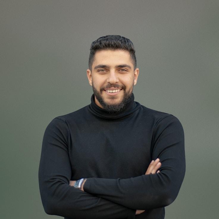 Alex Doe, Lead Design Curator at Anchor Vista Stable, reviewing corporate floral arrangements